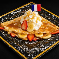 French Crêperie - L' amour Crêpe. Cinnamon Sugar, butter and caramel with your choice of strawberries, bananas or both.