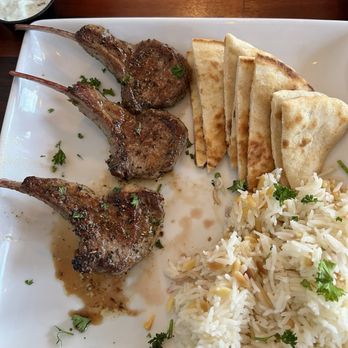 Fire and Food - Lamb chops (already ate one) pita and rice - Greek Near Me - Milton, Florida Fire and Food - Lamb chops (already ate one) pita and rice - Greek Near Me - Milton, Florida