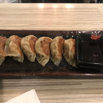 Ooink - Gyoza appetizer - note the hot peppers above the soy sauce - Ramen Near Me - Seattle, Washington Ooink - Gyoza appetizer - note the hot peppers above the soy sauce - Ramen Near Me - Seattle, Washington