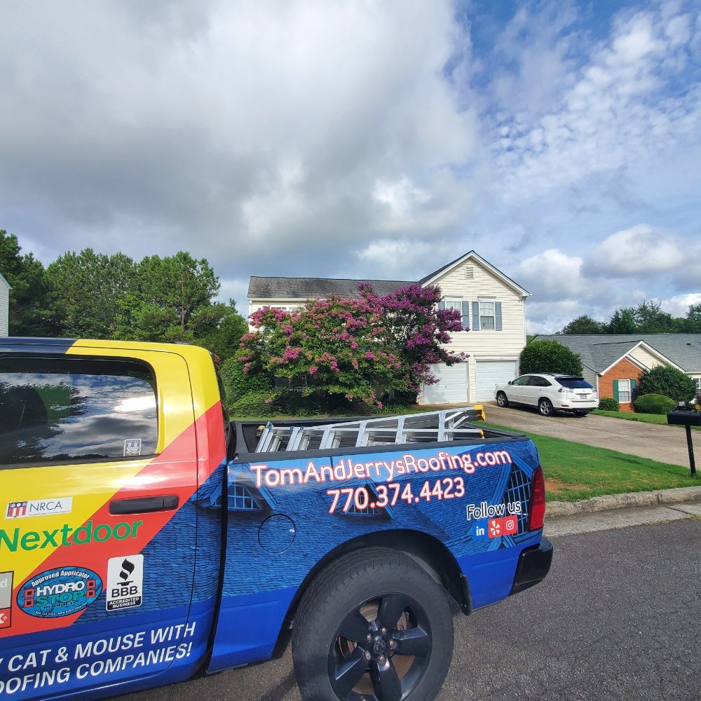 Slide of Tom and Jerry's Roofing