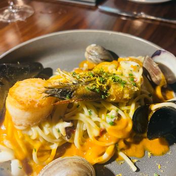 Il Girasole - Taglierini with clams, mussels, calamari, scallops, and a prawn - Italian Near Me - Costa Mesa, California Il Girasole - Taglierini with clams, mussels, calamari, scallops, and a prawn - Italian Near Me - Costa Mesa, California