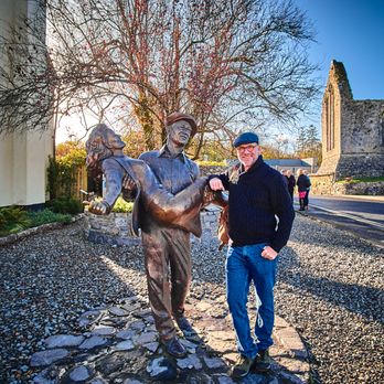 Great Value Vacations - Statue tribute to "The Quiet Man" in Hong. - Travel Services Near Me - Rockville Centre, New York