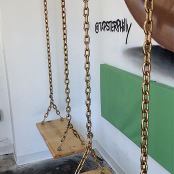 Tapster Philadelphia - a pair of swings hanging from the ceiling - Sports Bars Near Me - Philadelphia, Pennsylvania Tapster Philadelphia - a pair of swings hanging from the ceiling - Sports Bars Near Me - Philadelphia, Pennsylvania