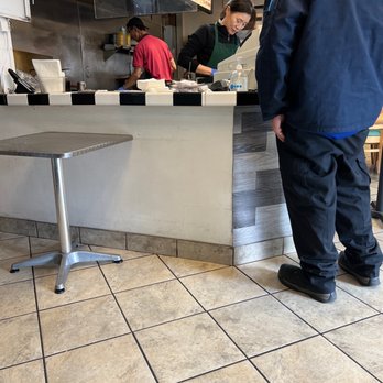 J J Grill - a man standing at the counter - Breakfast & Brunch Near Me - Ontario, California