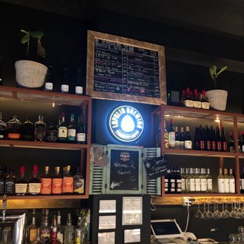 Fenders - a bar with a chalkboard menu and wine glasses - Cafes Near Me - Norfolk, Nebraska