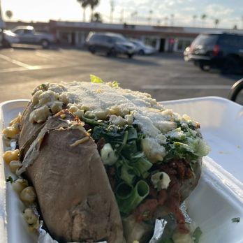 Elote - "Baked" potato with adobada, onion, corn, Parmesan cheese - Mexican Near Me - Escondido, California