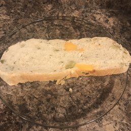 Slice of the stuffed potato bread loaf with lots of cheese and broccoli inside - delicious!