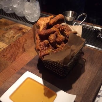 Carson Kitchen - The famous chicken skins with honey dip sauce! Goes great with a beer also! =) - New American Near Me - Las Vegas, Nevada