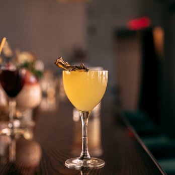 Oorja - a cocktail in a glass on a bar - Cocktail Bars Near Me - Montreal, Quebec Oorja - a cocktail in a glass on a bar - Cocktail Bars Near Me - Montreal, Quebec