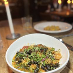 Acanto - Fusilli with squid ink pasta, lobster, scallops, shrimp, san marzano tomatoes, calabrian chili, crispy garlic