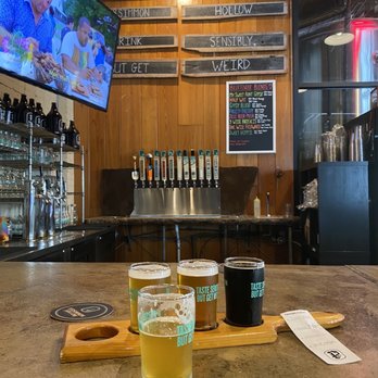 Persimmon Hollow Brewing - beer glasses on a bar - Breweries Near Me - DeLand, Florida