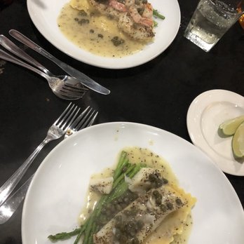 Puccini's - Sea Bass w/shrimp on lobster ravioli and Halibut on lobster ravioli both w lemon caper sauce - Italian Near Me - Sarasota, Florida