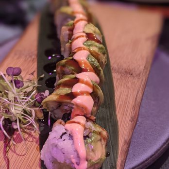 MamaSushi - a sushi roll on a wooden board - Sushi Bars Near Me - Passaic, New Jersey MamaSushi - a sushi roll on a wooden board - Sushi Bars Near Me - Passaic, New Jersey