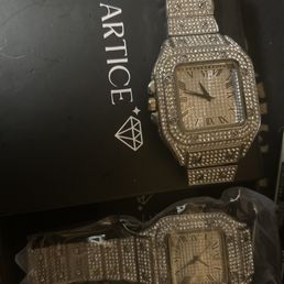 The watch n the plastic is Cartice the other is the 6$ aliexpress watch