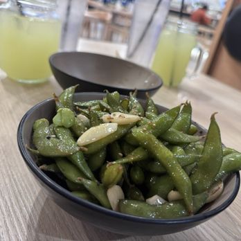 Tanoshi Japanese Bistro - Garlic edamame - Sushi Bars Near Me - Walnut Creek, California Tanoshi Japanese Bistro - Garlic edamame - Sushi Bars Near Me - Walnut Creek, California