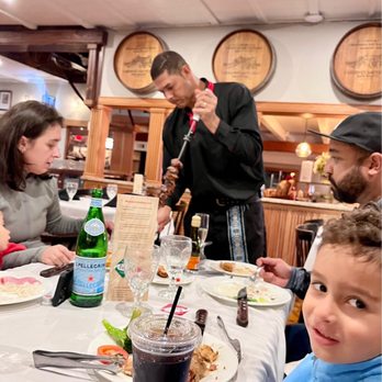 Brazilian Grill - Our Brazilian Grille Server with a grilled steak offering. - Steakhouses Near Me - Hyannis, Massachusetts Brazilian Grill - Our Brazilian Grille Server with a grilled steak offering. - Steakhouses Near Me - Hyannis, Massachusetts