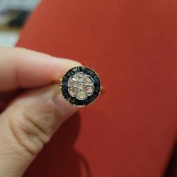 Real Jewelers - My original antique ring displaying the center flower but worn setting.