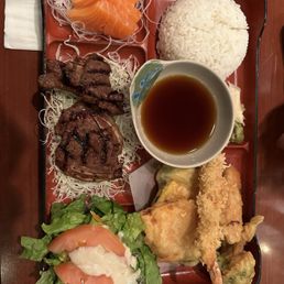 Bento box with beef galbo and salmon sashimi Bento box with beef galbo and salmon sashimi