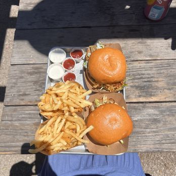 The Barn - Fries, Hot Farmer burger (top), Barn Burger (bottom), with a side of buttermilk for dipping sauce - Burgers Near Me - Half Moon Bay, California The Barn - Fries, Hot Farmer burger (top), Barn Burger (bottom), with a side of buttermilk for dipping sauce - Burgers Near Me - Half Moon Bay, California