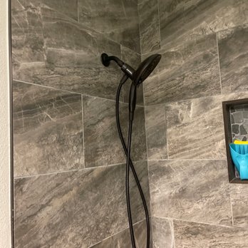 VALENZ CONSTRUCTION GROUP - a shower head and shower hose - General Contractors Near Me