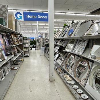 Gabe's - Mirrors, canvas prints, etc. - Aisle in a retail store with shelves displaying mirrors and home decor products, under bright fluorescent lighting. - Women's Clothing Near Me - Washington, Pennsylvania