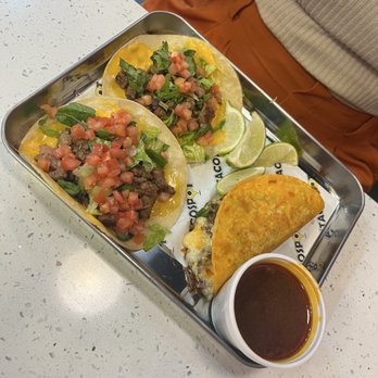 The Taco Spot - Kissimmee - 3 regular tacos. 2 asada and 1 birria. Consommé had to be added. Cheese melted on tortilla before fillings are added! - Tacos Near Me - Kissimmee, Florida