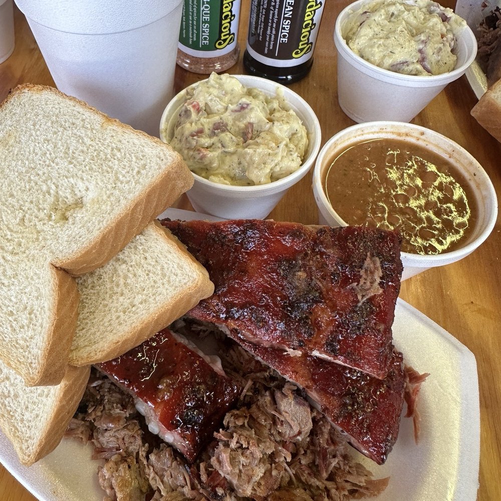 Combination plate with chopped beef, ribs, beans and potato salad with sweet tea ! (Also got seasoning) Combination plate with chopped beef, ribs, beans and potato salad with sweet tea ! (Also got seasoning)