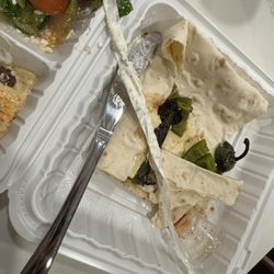 Sam's Flaming Grill - Plastic wrap in cucumber yogurt.