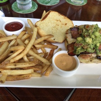 Tommy Bahama - California club sandwich special with homemade guacamole and fries - Seafood Near Me - Naples, Florida Tommy Bahama - California club sandwich special with homemade guacamole and fries - Seafood Near Me - Naples, Florida