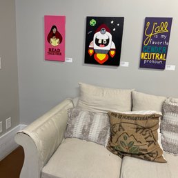 a white couch with pillows a white couch with pillows