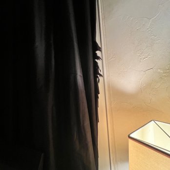 Resort Realty - Worn curtains in zebra room - Real Estate Agents Near Me - Corolla, North Carolina