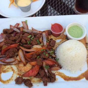 Chef Paz Restaurant - Mar y Tierra, tenderloin pieces with shrimp, tomatoes and onions. Served with rice and potato fries. - Peruvian Near Me - West Allis, Wisconsin Chef Paz Restaurant - Mar y Tierra, tenderloin pieces with shrimp, tomatoes and onions. Served with rice and potato fries. - Peruvian Near Me - West Allis, Wisconsin
