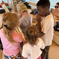 Bulls Island Ferry - Looking at treasures from the beach