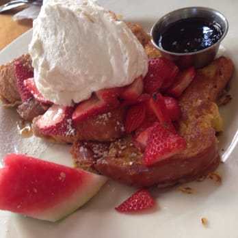 Fig Tree Cafe - French toast with strawberries and whipped cream topping with delicious orange-infused syrup! - Sandwiches Near Me - Pacific Beach, California Fig Tree Cafe - French toast with strawberries and whipped cream topping with delicious orange-infused syrup! - Sandwiches Near Me - Pacific Beach, California