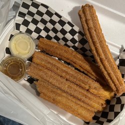 Churros Y Platanos - Churros with Caramel and Lechera sauce on the side.