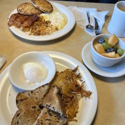 Union Diner - His eggs over med, crispy bacon, hash browns English muffin, coffee. My poached egg, raisin toast, hash browns, fruit, coffee.