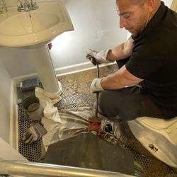 Rescue Plumbing - Plumber Pete performing a drain cleaning service