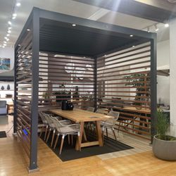 Terra Outdoor Living - Madera vintage dining table paired with Napa dining chairs under a TUUCI cabana