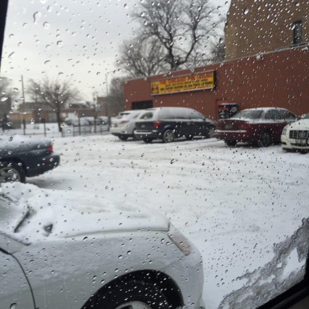 a view of a snowy parking lot a view of a snowy parking lot