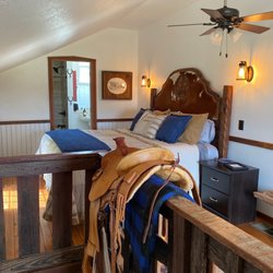 King bed and private bathroom in upstairs loft.