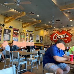 people sitting at tables in a restaurant people sitting at tables in a restaurant