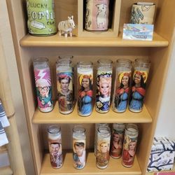 Summer House Design - Love the variety of patron saint candles here.