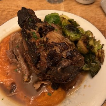Kettle Black Kitchen - Maple braised bone in pork shank with carrot purée, Brussels sprouts, and maple pan sauce. - French Near Me - Madison, Wisconsin