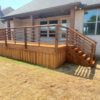 Gomez Fence & Landscape - a view of a backyard with a deck and stairs - Fences & Gates Near Me Gomez Fence & Landscape - a view of a backyard with a deck and stairs - Fences & Gates Near Me