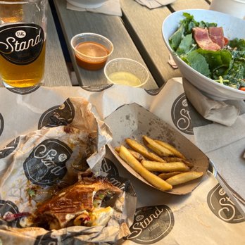 The Stand - American Classics Redefined - BBQ Brisket on a Pretzel Roll + Stand Fries + Baby Kale & Quinoa Salad. - New American Near Me - Pasadena, California The Stand - American Classics Redefined - BBQ Brisket on a Pretzel Roll + Stand Fries + Baby Kale & Quinoa Salad. - New American Near Me - Pasadena, California