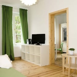 Seaside - Appartements Rügen Light Blue - Wohnzimmer green Ferienwohnung Sassnitz