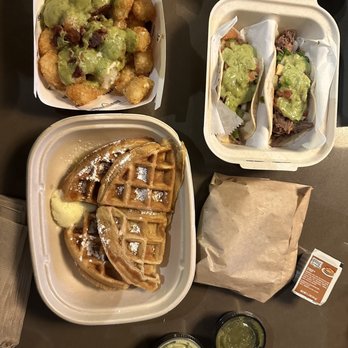 Effin Egg - waffles and guacamole on a table - Breakfast & Brunch Near Me - Decatur, Georgia
