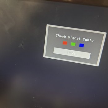 Ez Tech Computers - Etc - A monitor shows a message indicating to check the signal cable, with red, green, and blue indicator lights and an HDMI input option. - IT Services & Computer Repair Near Me - Beachwood, New Jersey
