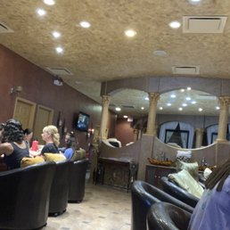 Nail stations, pedicure chairs and a private pedicure section in the rear.