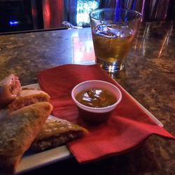 Twisted Rooster Bar - Ruben egg rolls with a double of Burbon on the side. That's a famn good night.